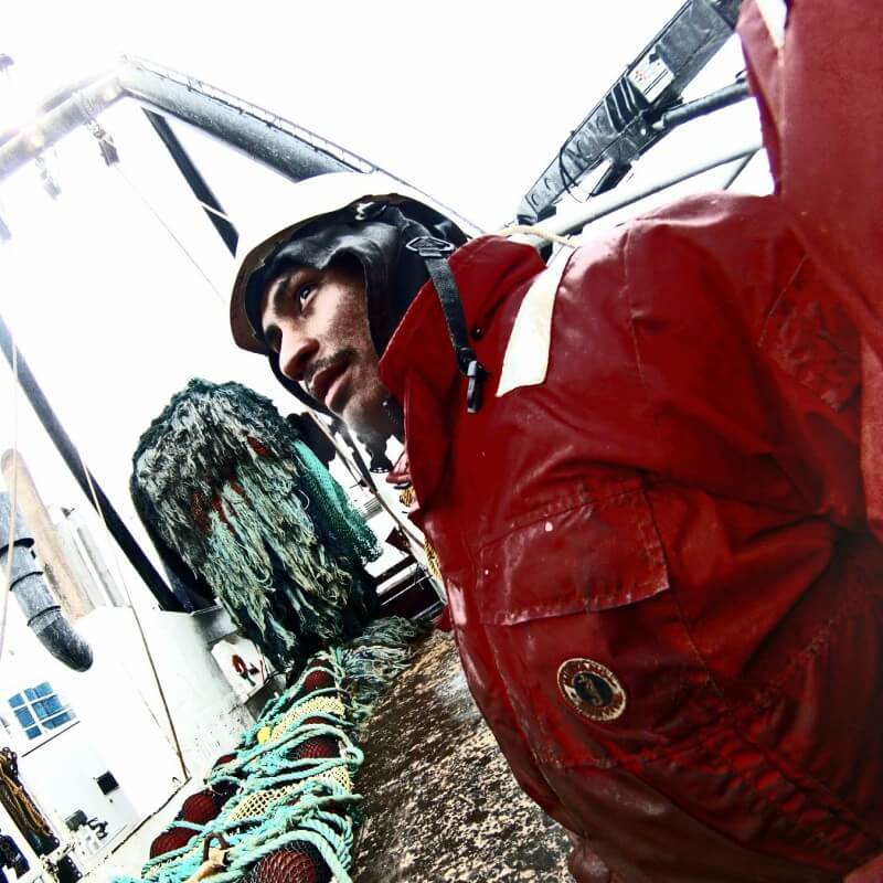 deckhand Matt Mata on a fishing boat in the Bering Sea